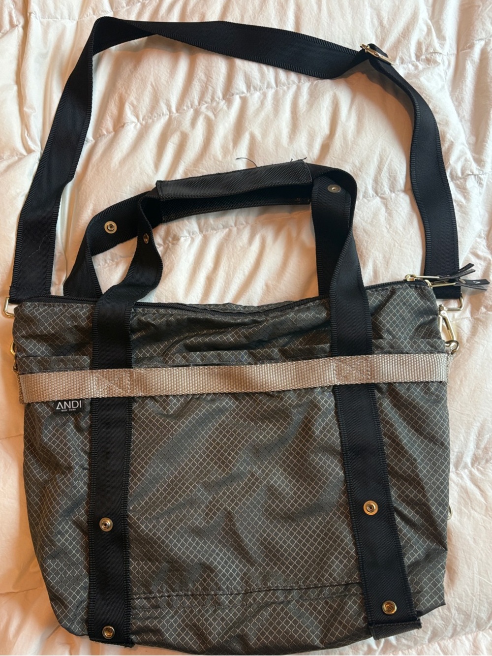 ANDI New York convertible tote bag in a gray grid pattern.